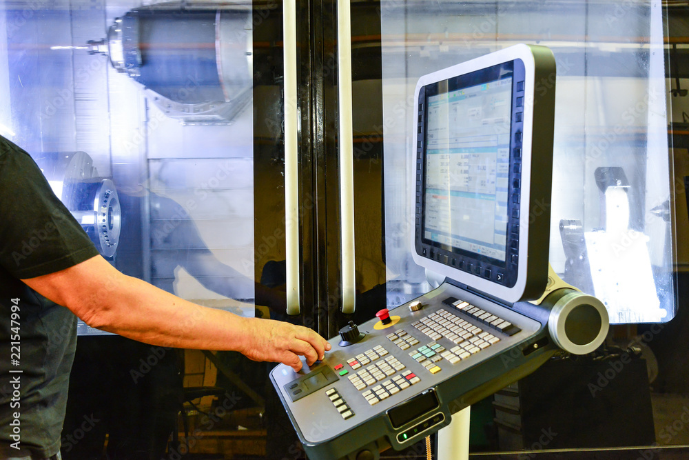 Operator monitoring an automated process line from a control station